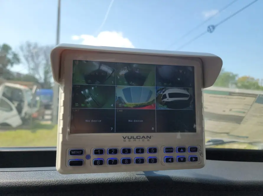 Dashboard-mounted Vulcan Series vehicle monitoring display showing multiple live camera feeds from different angles around a fleet or service vehicle, providing enhanced driver visibility, safety, and situational awareness.