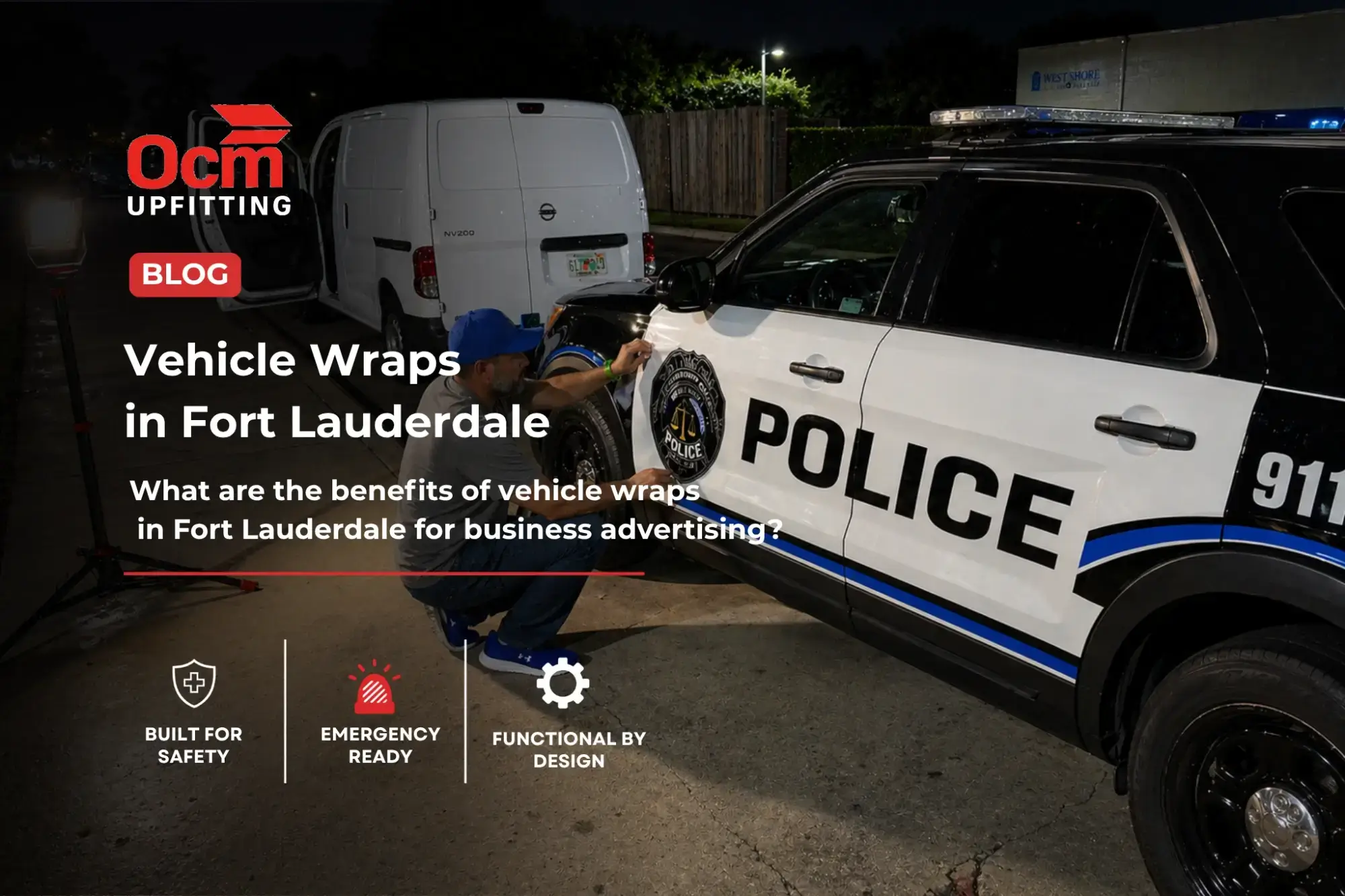 Technician applying a professional vinyl vehicle wrap on a police SUV in a well-lit outdoor setting at night