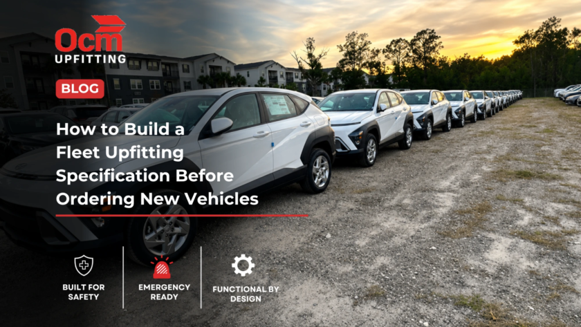 Long row of white fleet SUVs parked on a gravel lot at sunset, showcasing a newly delivered fleet vehicle lineup with uniform configuration, professional appearance, and a residential development in the background.