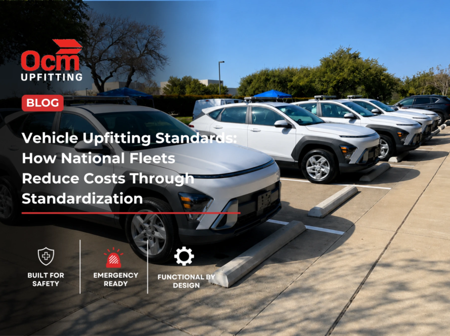 Row of white Allied Universal security fleet SUVs parked in a clean outdoor parking lot under a clear blue sky, showcasing standardized fleet vehicles equipped with roof-mounted emergency lighting and professional fleet branding.