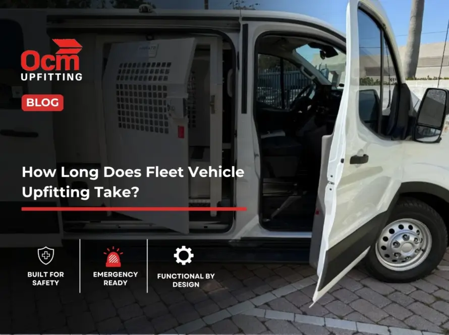 White commercial fleet van with open doors showing a custom metal partition and secure interior upfitting system.