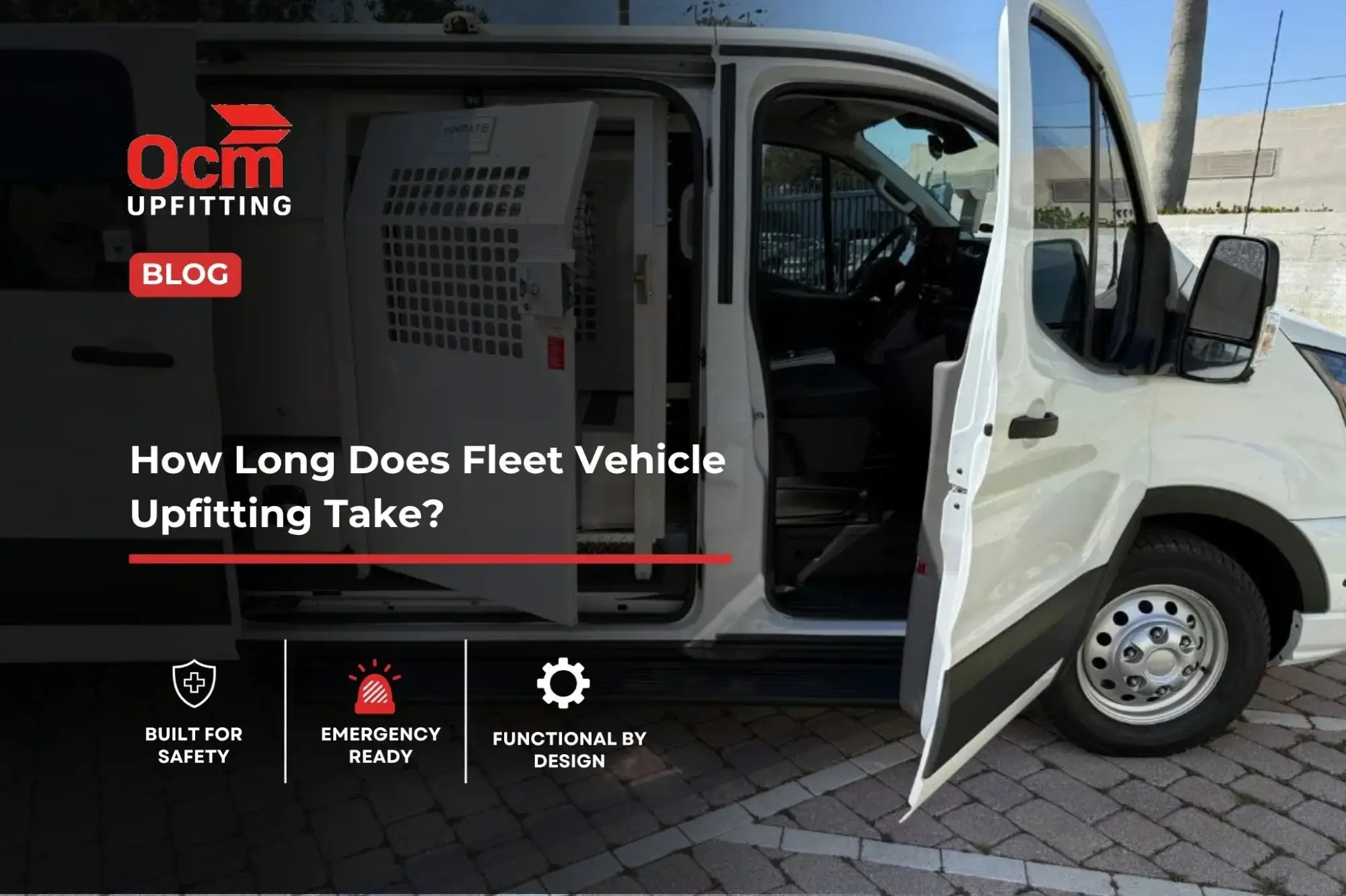 White commercial fleet van with open doors showing a custom metal partition and secure interior upfitting system.