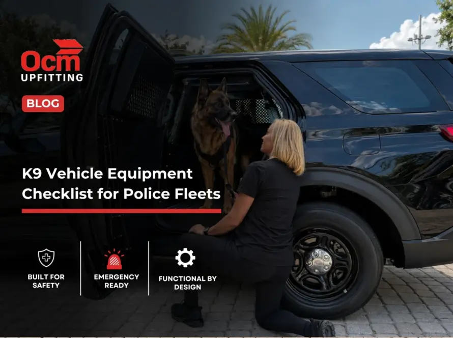 Police K9 handler beside a German Shepherd in a secure transport module inside a black law enforcement SUV, showcasing professional K9 vehicle equipment.