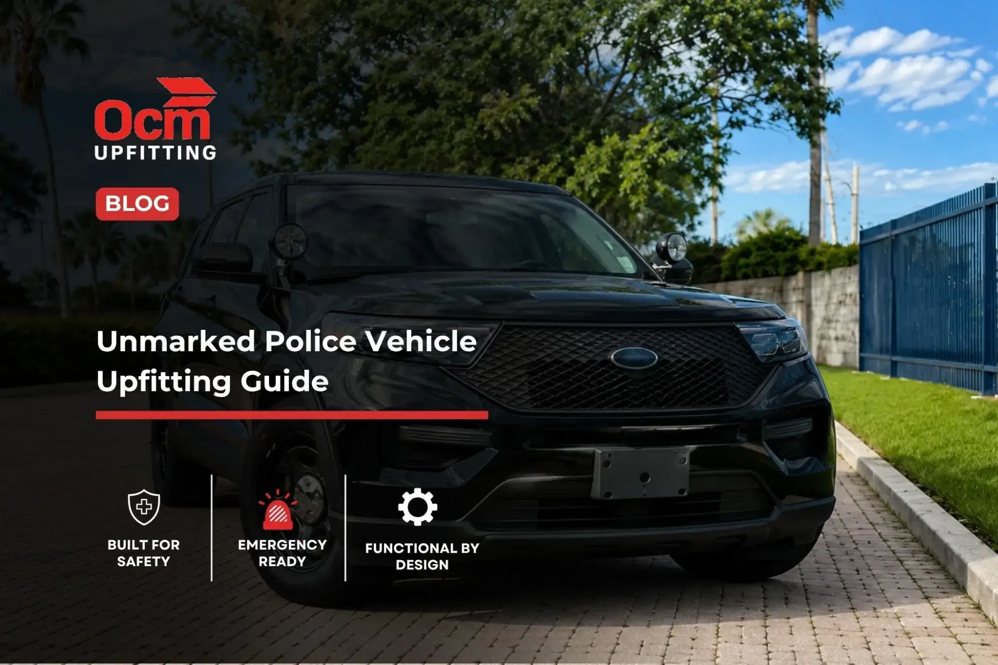 Front-facing black unmarked police SUV with dual spotlights parked on a brick-paved lot, illustrating professional unmarked police vehicle upfitting.