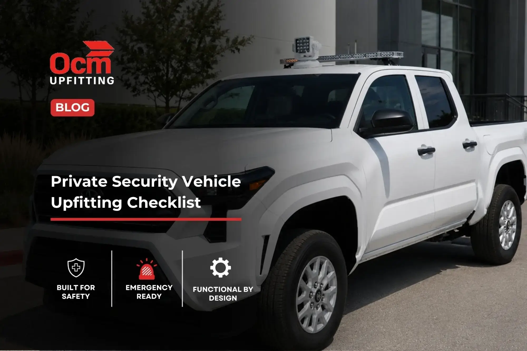 White private security patrol pickup truck with roof-mounted warning and visibility equipment parked outside a professional vehicle upfitting facility.