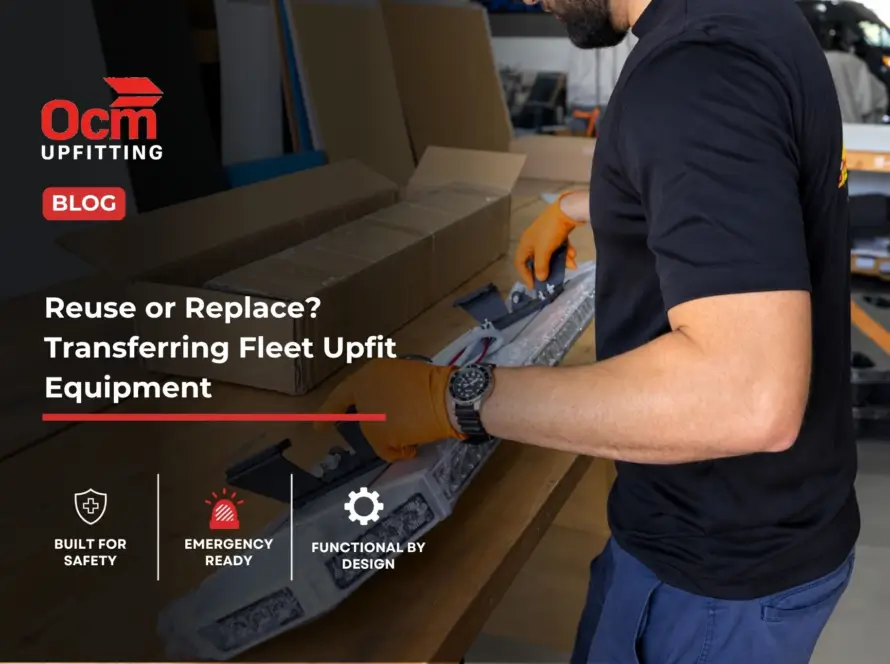 Technician inspecting and assembling a vehicle LED light bar on a workbench inside a professional fleet upfitting shop.